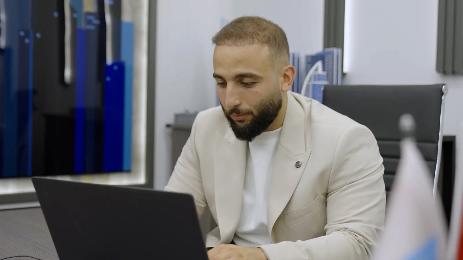 A team member working at his desk