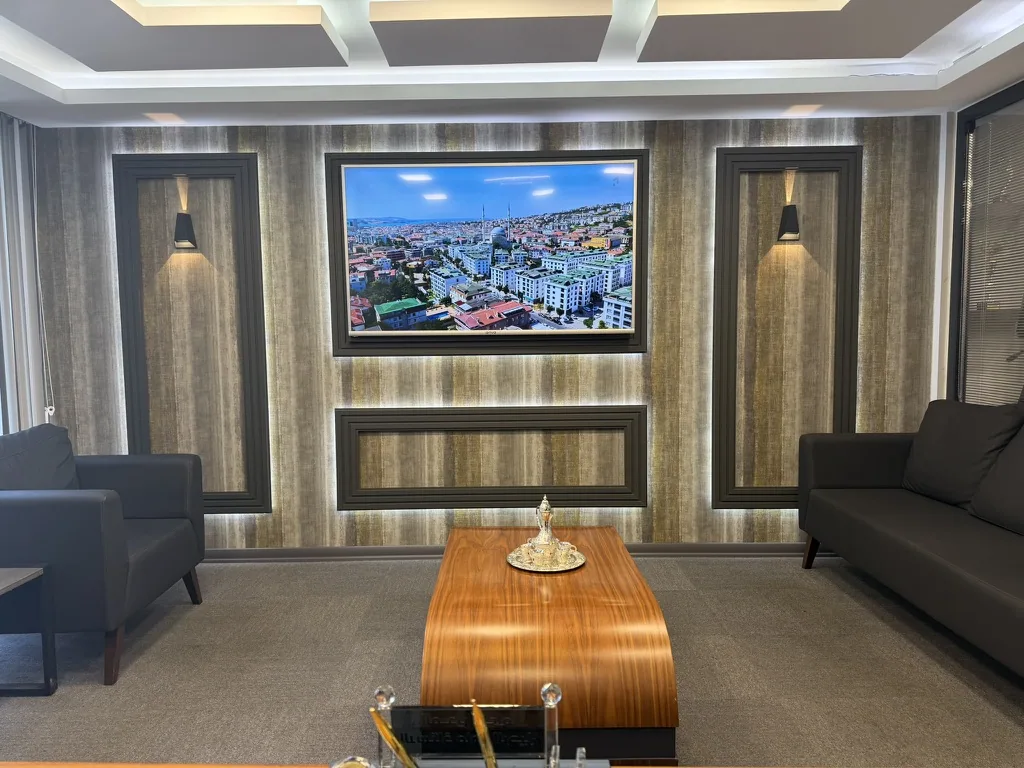 The meeting lounge, with an aerial photograph of the district on the wall